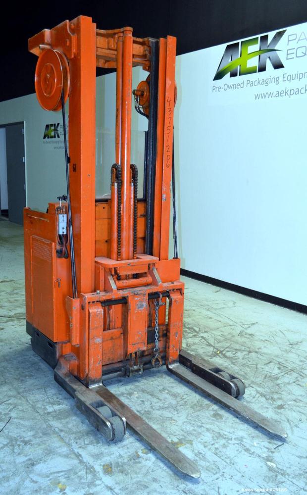 Used Raymond Corporation Stand Up Electric Reach Lift Truck, Model 20-R30TT. 3000 Pound capacity at 190” lift height. (2) Stage mast. Includes a Gould 24 volt battery charger, model GFC-12-900T1. Hou...