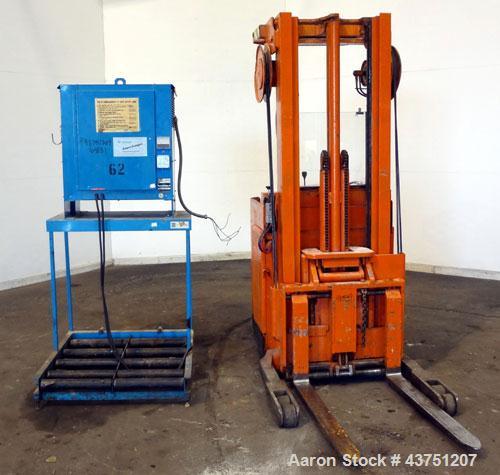 Used Raymond Corporation Stand Up Electric Reach Lift Truck, Model 20-R30TT. 3000 Pound capacity at 190” lift height. (2) Stage mast. Includes a Gould 24 volt battery charger, model GFC-12-900T1. Hou...