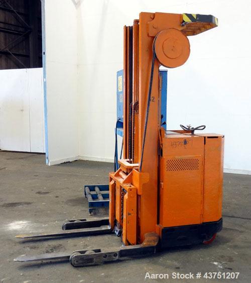 Used Raymond Corporation Stand Up Electric Reach Lift Truck, Model 20-R30TT. 3000 Pound capacity at 190” lift height. (2) Stage mast. Includes a Gould 24 volt battery charger, model GFC-12-900T1. Hou...