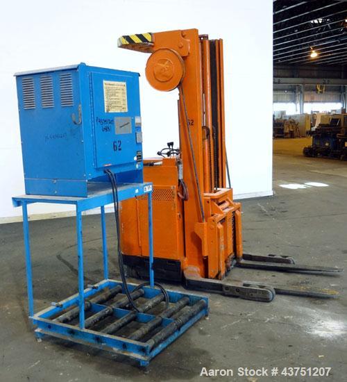 Used Raymond Corporation Stand Up Electric Reach Lift Truck, Model 20-R30TT. 3000 Pound capacity at 190” lift height. (2) Stage mast. Includes a Gould 24 volt battery charger, model GFC-12-900T1. Hou...