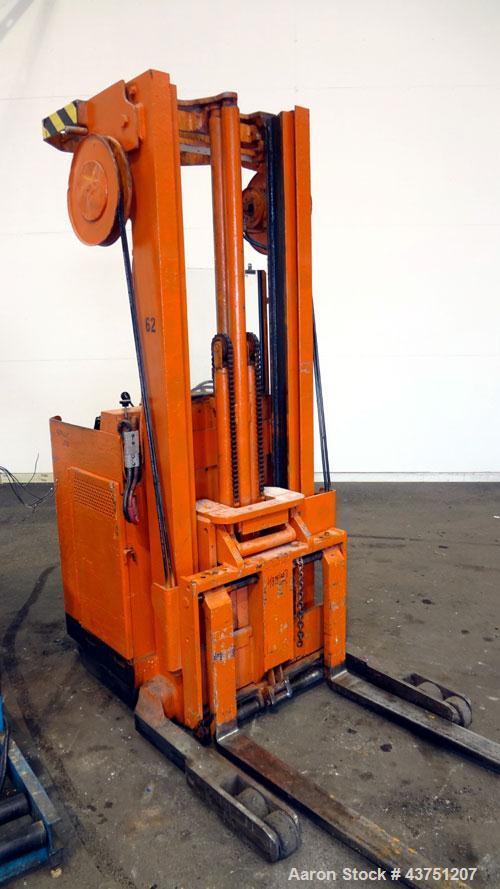 Used Raymond Corporation Stand Up Electric Reach Lift Truck, Model 20-R30TT. 3000 Pound capacity at 190” lift height. (2) Stage mast. Includes a Gould 24 volt battery charger, model GFC-12-900T1. Hou...
