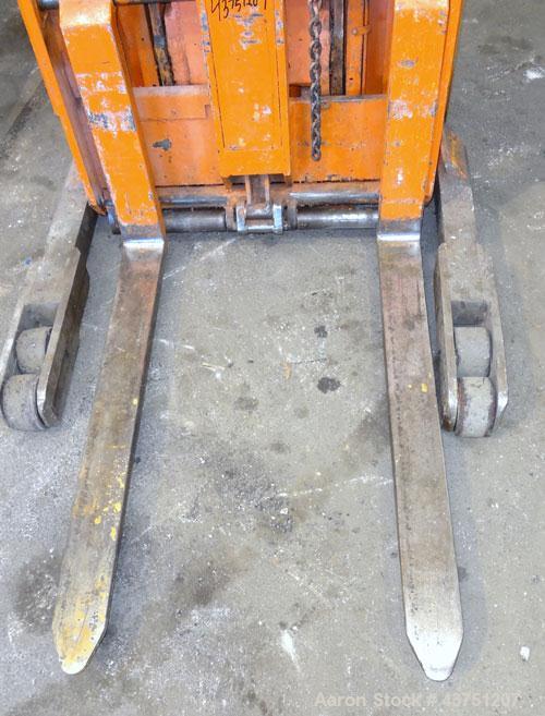 Used Raymond Corporation Stand Up Electric Reach Lift Truck, Model 20-R30TT. 3000 Pound capacity at 190” lift height. (2) Stage mast. Includes a Gould 24 volt battery charger, model GFC-12-900T1. Hou...