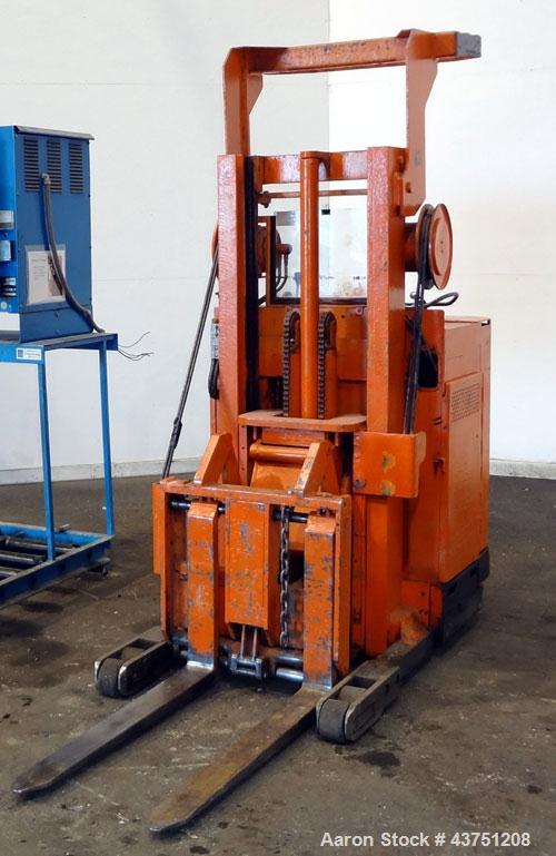 Used Raymond Corporation Stand Up Electric Reach Lift Truck, Model 20-R30TT. 3000 Pound capacity at 190” lift height. (2) Stage mast. Includes a Gould 24 volt battery charger, model GFC-12-900T1. Hou...