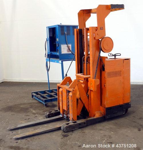 Used Raymond Corporation Stand Up Electric Reach Lift Truck, Model 20-R30TT. 3000 Pound capacity at 190” lift height. (2) Stage mast. Includes a Gould 24 volt battery charger, model GFC-12-900T1. Hou...