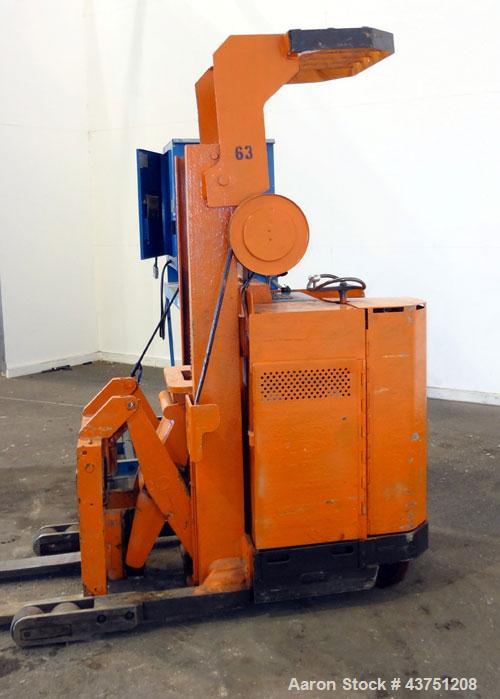 Used Raymond Corporation Stand Up Electric Reach Lift Truck, Model 20-R30TT. 3000 Pound capacity at 190” lift height. (2) Stage mast. Includes a Gould 24 volt battery charger, model GFC-12-900T1. Hou...