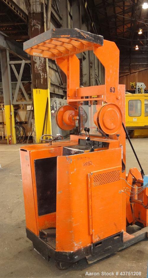 Used Raymond Corporation Stand Up Electric Reach Lift Truck, Model 20-R30TT. 3000 Pound capacity at 190” lift height. (2) Stage mast. Includes a Gould 24 volt battery charger, model GFC-12-900T1. Hou...
