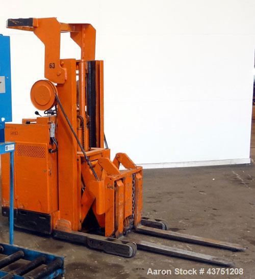 Used Raymond Corporation Stand Up Electric Reach Lift Truck, Model 20-R30TT. 3000 Pound capacity at 190” lift height. (2) Stage mast. Includes a Gould 24 volt battery charger, model GFC-12-900T1. Hou...