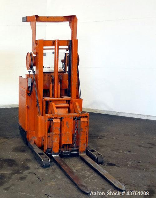 Used Raymond Corporation Stand Up Electric Reach Lift Truck, Model 20-R30TT. 3000 Pound capacity at 190” lift height. (2) Stage mast. Includes a Gould 24 volt battery charger, model GFC-12-900T1. Hou...