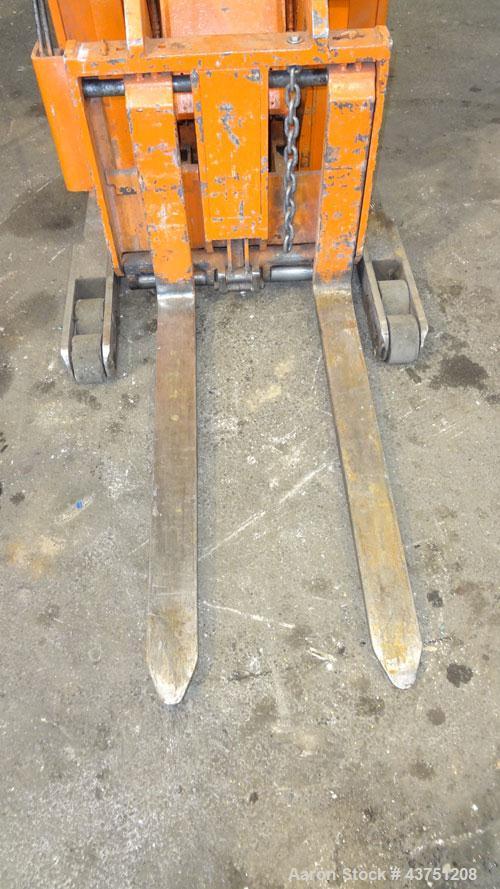 Used Raymond Corporation Stand Up Electric Reach Lift Truck, Model 20-R30TT. 3000 Pound capacity at 190” lift height. (2) Stage mast. Includes a Gould 24 volt battery charger, model GFC-12-900T1. Hou...