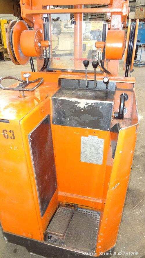 Used Raymond Corporation Stand Up Electric Reach Lift Truck, Model 20-R30TT. 3000 Pound capacity at 190” lift height. (2) Stage mast. Includes a Gould 24 volt battery charger, model GFC-12-900T1. Hou...