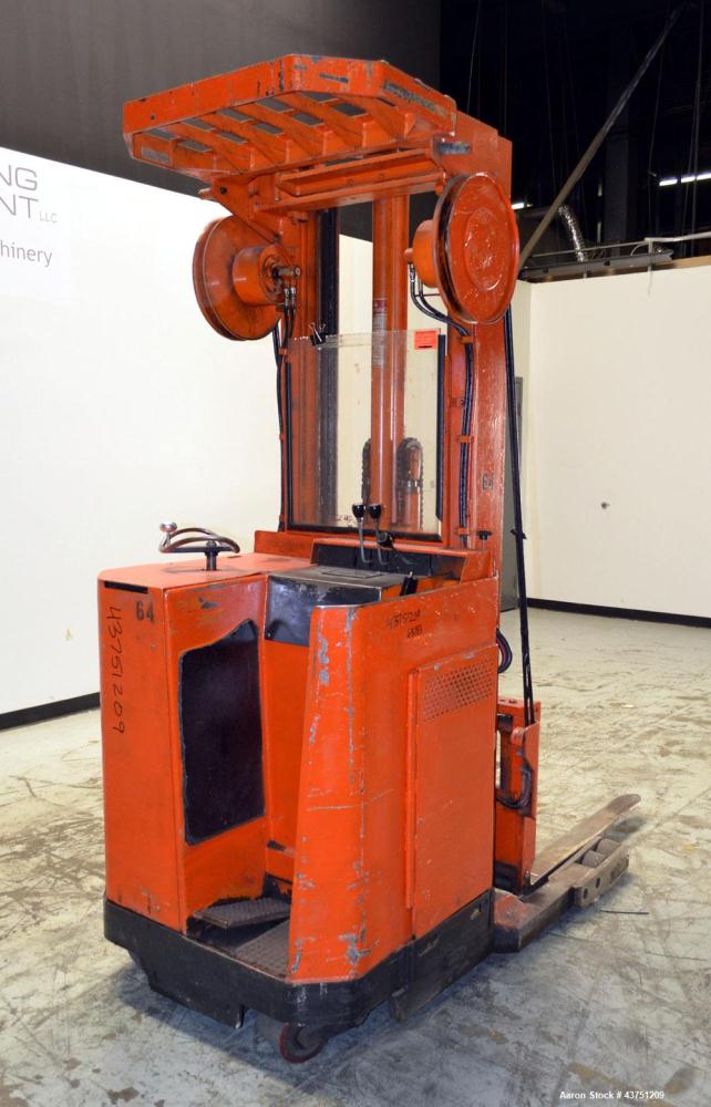 Used Raymond Corporation Stand Up Electric Reach Lift Truck, Model 20-R30TT. 3000 Pound capacity at 190” lift height. (2) Stage mast. Includes a Gould 24 volt battery charger, model GFC-12-900T1. Hou...