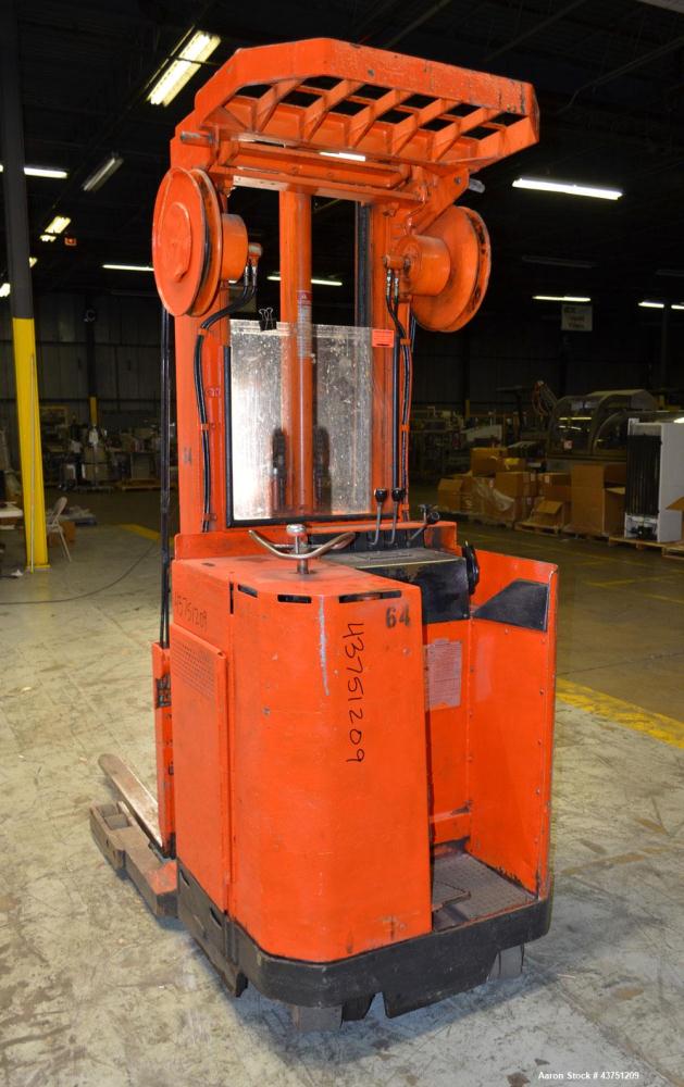 Used Raymond Corporation Stand Up Electric Reach Lift Truck, Model 20-R30TT. 3000 Pound capacity at 190” lift height. (2) Stage mast. Includes a Gould 24 volt battery charger, model GFC-12-900T1. Hou...