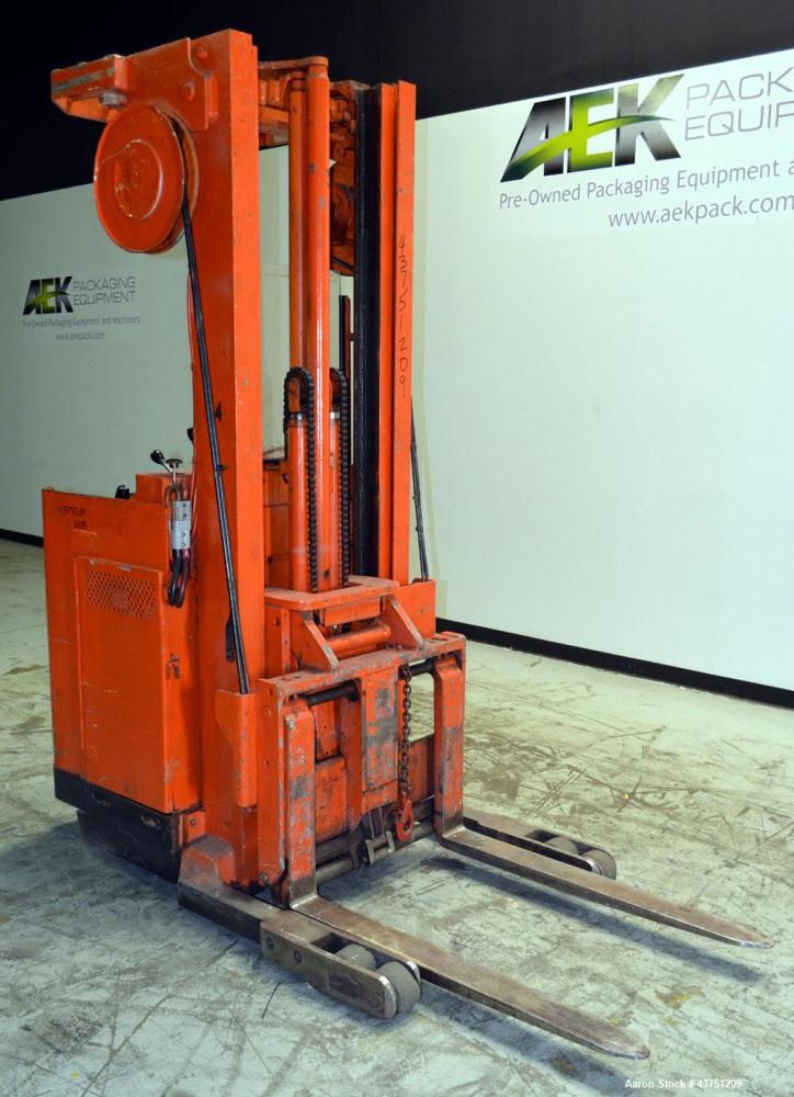 Used Raymond Corporation Stand Up Electric Reach Lift Truck, Model 20-R30TT. 3000 Pound capacity at 190” lift height. (2) Stage mast. Includes a Gould 24 volt battery charger, model GFC-12-900T1. Hou...