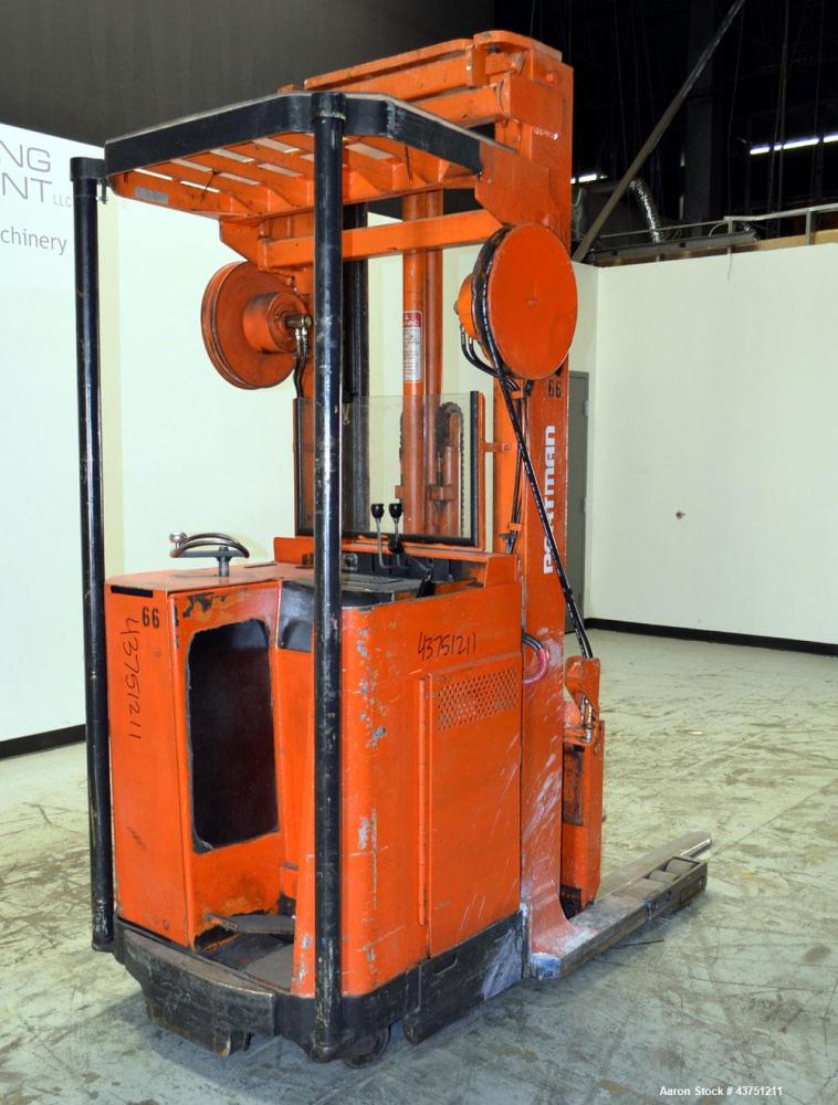 Used Raymond Corporation Stand Up Electric Reach Lift Truck, Model 20-R30TT. 3000 Pound capacity at 190” lift height. (2) Stage mast. Includes a Gould 24 volt battery charger, model GFC-12-900T1.