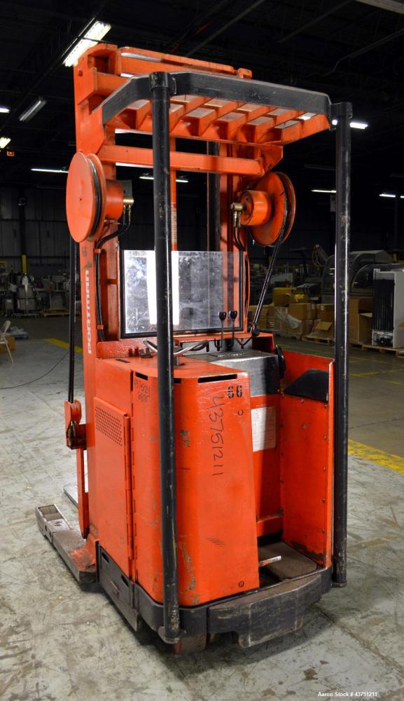 Used Raymond Corporation Stand Up Electric Reach Lift Truck, Model 20-R30TT. 3000 Pound capacity at 190” lift height. (2) Stage mast. Includes a Gould 24 volt battery charger, model GFC-12-900T1.