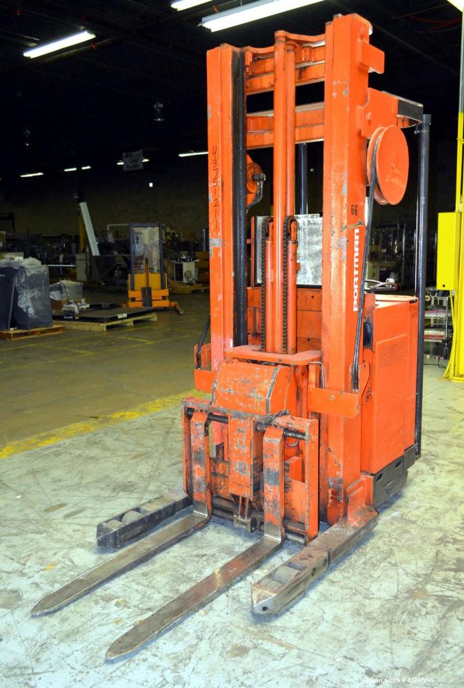Used Raymond Corporation Stand Up Electric Reach Lift Truck, Model 20-R30TT. 3000 Pound capacity at 190” lift height. (2) Stage mast. Includes a Gould 24 volt battery charger, model GFC-12-900T1.