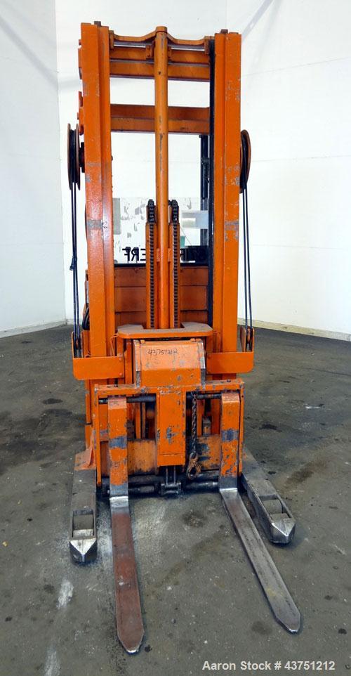 Used Raymond Corporation Stand Up Electric Reach Lift Truck, Model 20-R30TT. 3000 Pound capacity at 190” lift height. (2) Stage mast. Includes a Gould 24 volt battery charger, model GFC-12-900T1. Hou...