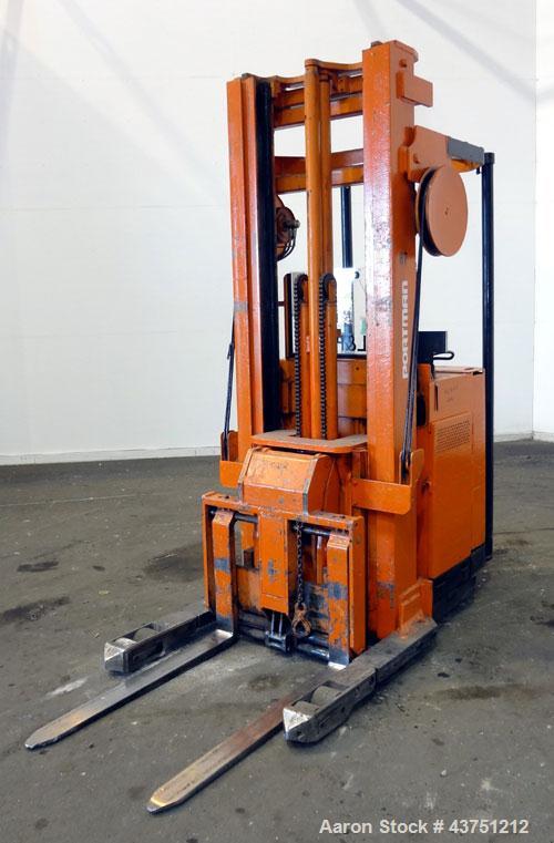 Used Raymond Corporation Stand Up Electric Reach Lift Truck, Model 20-R30TT. 3000 Pound capacity at 190” lift height. (2) Stage mast. Includes a Gould 24 volt battery charger, model GFC-12-900T1. Hou...