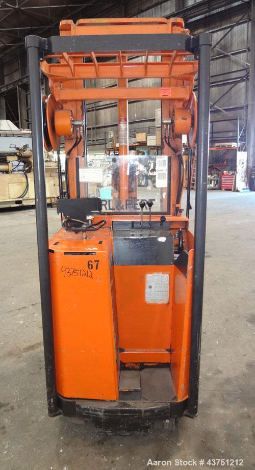 Used Raymond Corporation Stand Up Electric Reach Lift Truck, Model 20-R30TT. 3000 Pound capacity at 190” lift height. (2) Stage mast. Includes a Gould 24 volt battery charger, model GFC-12-900T1. Hou...