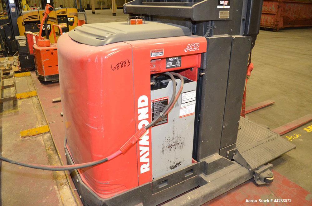 Used Raymond Model 550-0PC30TT, 3,000 Pound Capacity Electric Stand Up Riding Cherry Picker Style Lift 3,000 Pound Capacity Electric Stand Up Riding Cherry Picker Style Lift, 315 in Maximum Elevation...