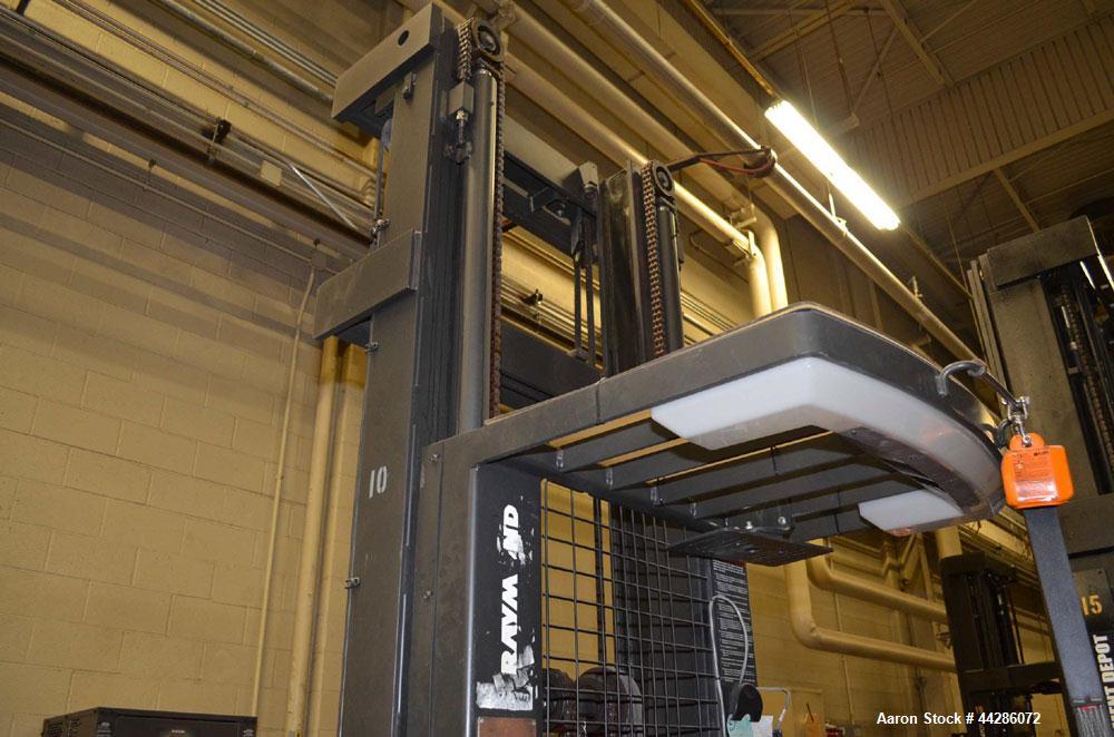 Used Raymond Model 550-0PC30TT, 3,000 Pound Capacity Electric Stand Up Riding Cherry Picker Style Lift 3,000 Pound Capacity Electric Stand Up Riding Cherry Picker Style Lift, 315 in Maximum Elevation...