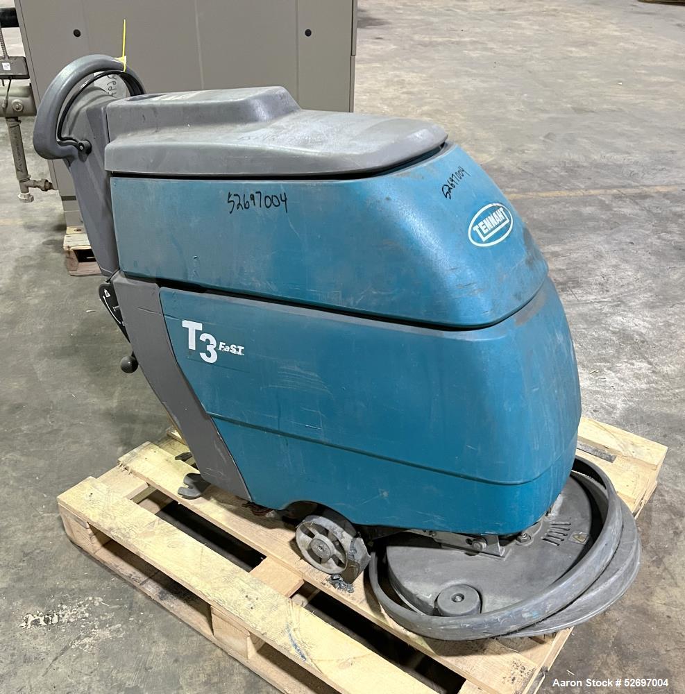 Used- Tennant Floor Scrubber, Model T3 20". 20" diameter scrubbing pad driven by a 1hp brush motor, max speed of 230rpm. 10....