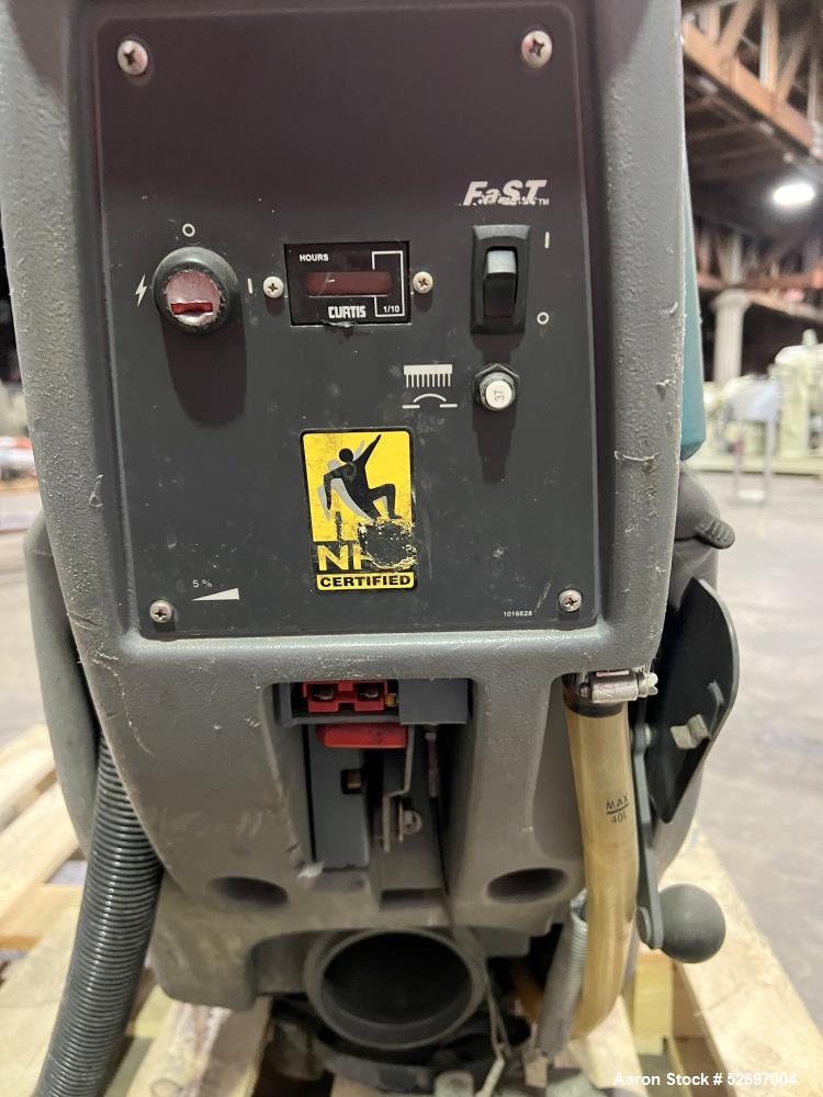 Used- Tennant Floor Scrubber, Model T3 20". 20" diameter scrubbing pad driven by a 1hp brush motor, max speed of 230rpm. 10....