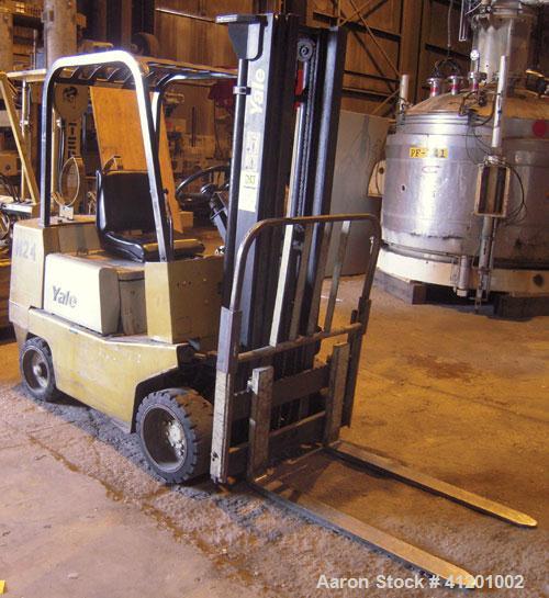 Used Yale Lift Truck, Model GLC040ADJUAE083, 4000 lb capacity. Triple mast with 5 degree backtilt, solid tire. (2) 42" long forks. Runs on propane gas.