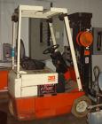Used Nissan forklift, model 30, battery, with charger.