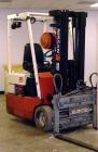 Used Nissan forklift, model 30, battery, with charger.