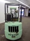 Used Hyster Lift Truck, Model S40F, 4000 Pound Capacity. Double mast, (2) 41-1/2” long  X 4” wide forks. Solid tire, runs on gas. Missing engine cover, and seat.