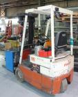 Used Nissan 3 Wheel Sit Down Electric Forklift, Model OT30, Type E. 2700 Pound capacity, triple mast. Includes a charger.