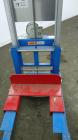 Used Genie GL Lift. 350 Pound lifting capacity. Aluminum and carbon steel frame with casters.	