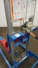 Used Genie GL Lift. 350 Pound lifting capacity. Aluminum and carbon steel frame with casters.	