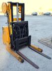Used Big Joe Electric Walk Behind Reach Truck, Model PDR-20-106. Lifting capacity 2000 pounds at 24’’ center. Lift range 106’’, turning radius from 65’’. Lift speed empty 15’ per minute, loaded 10’ p...