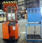 Used Raymond Corporation Stand Up Electric Reach Lift Truck, Model 20-R30TT. 3000 Pound capacity at 190” lift height. (2) Stage mast. Includes a Gould 24 volt battery charger, model GFC-12-900T1. Hou...