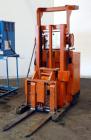 Used Raymond Corporation Stand Up Electric Reach Lift Truck, Model 20-R30TT. 3000 Pound capacity at 190” lift height. (2) Stage mast. Includes a Gould 24 volt battery charger, model GFC-12-900T1. Hou...