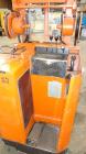 Used Raymond Corporation Stand Up Electric Reach Lift Truck, Model 20-R30TT. 3000 Pound capacity at 190” lift height. (2) Stage mast. Includes a Gould 24 volt battery charger, model GFC-12-900T1. Hou...