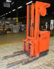 Used Raymond Corporation Stand Up Electric Reach Lift Truck, Model 20-R30TT. 3000 Pound capacity at 190” lift height. (2) Stage mast. Includes a Gould 24 volt battery charger, model GFC-12-900T1. Hou...