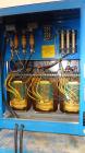 Used Raymond Corporation Stand Up Electric Reach Lift Truck, Model 20-R30TT. 3000 Pound capacity at 190” lift height. (2) Stage mast. Includes a Gould 24 volt battery charger, model GFC-12-900T1. Hou...