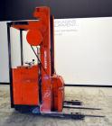 Used Raymond Corporation Stand Up Electric Reach Lift Truck, Model 20-R30TT. 3000 Pound capacity at 190” lift height. (2) Stage mast. Includes a Gould 24 volt battery charger, model GFC-12-900T1.