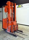 Used Raymond Corporation Stand Up Electric Reach Lift Truck, Model 20-R30TT. 3000 Pound capacity at 190” lift height. (2) Stage mast. Includes a Gould 24 volt battery charger, model GFC-12-900T1.