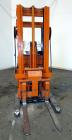 Used Raymond Corporation Stand Up Electric Reach Lift Truck, Model 20-R30TT. 3000 Pound capacity at 190” lift height. (2) Stage mast. Includes a Gould 24 volt battery charger, model GFC-12-900T1. Hou...