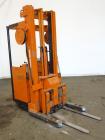 Used Raymond Corporation Stand Up Electric Reach Lift Truck, Model 20-R30TT. 3000 Pound capacity at 190” lift height. (2) Stage mast. Includes a Gould 24 volt battery charger, model GFC-12-900T1. Hou...