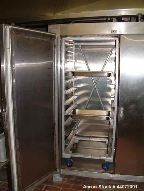 Used Liquid Carbonic Blast Freezer.Hammond and Martini electrical control panel.Double door upright blast freezer to handle two racks at a time.Stainless steel.CO2 or Liquid Nitrogen hookup required.