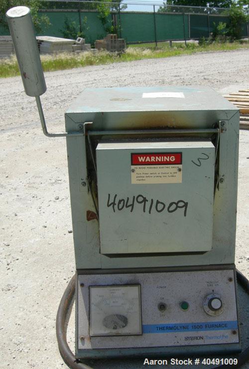 Used Thermolyne Benchtop Industrial Furnace, Model F-D1525M. Operating temperature 100-1200 deg C (212-2192 F). 136 cubic inch chamber 4" wide x 3 3/4" tall x 9" deep. Front door. 1/50/60/120 volt, 1...