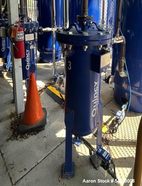 Used Quincy Air Treatment Unit. Industrial compressed-air vessel, identified as Unit 3, is a vertical steel separator/filter housing designed for inline air-treatment service within a multi-compresso...
