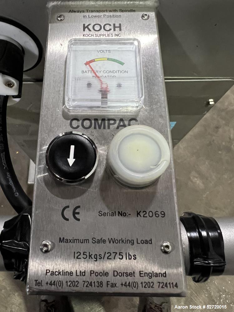 Used Packline Compac Platform Attachment Stainless Steel Portable Lift. Approximate capacity 275 Pounds. Approximate 80" lift height. Serial# K2069. Missing platform attachment.