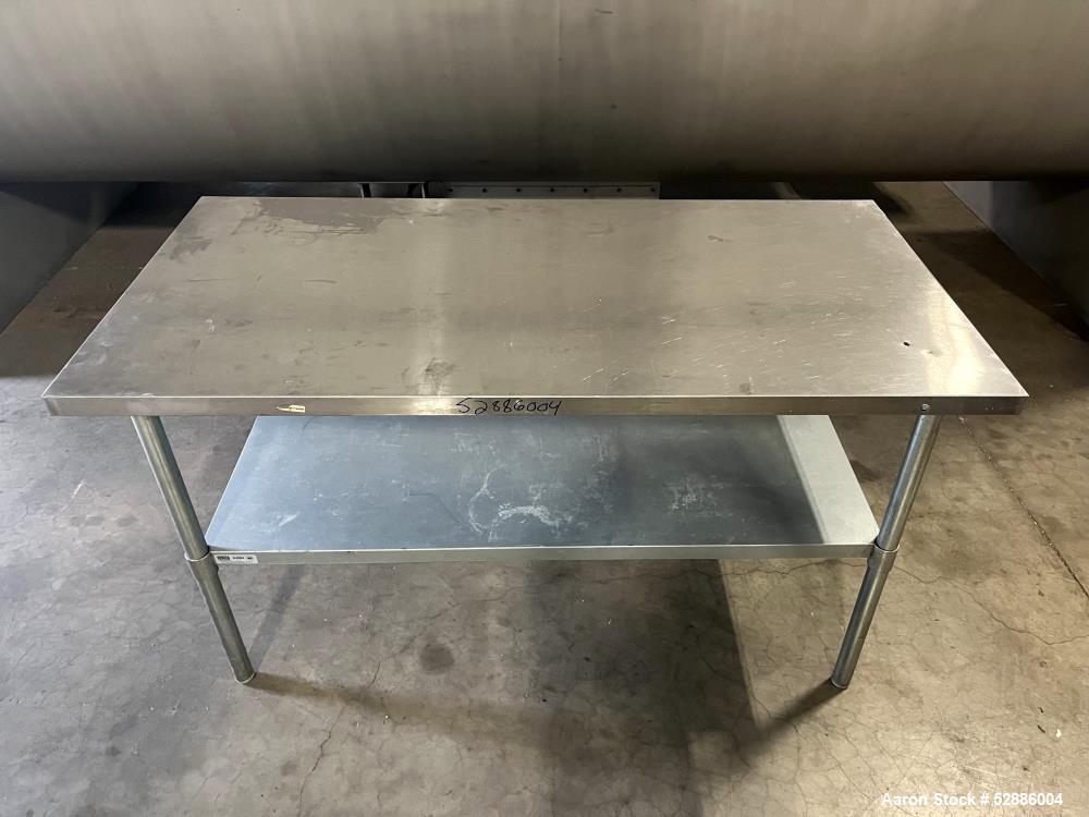 Used ULine Economy Stainless Steel Worktable with Bottom Shelf, 304 Stainless Steel. 60" long x 30" wide top surface, 53" long x 23" wide bottom surface. Mounted on 4 legs. ULine# H-8964.
