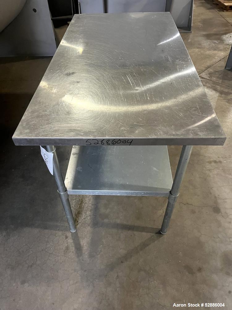 Used- ULine Economy Stainless Steel Worktable with Bottom Shelf, 304 Stainless Steel. 60" long x 30" wide top surface, 53" l...